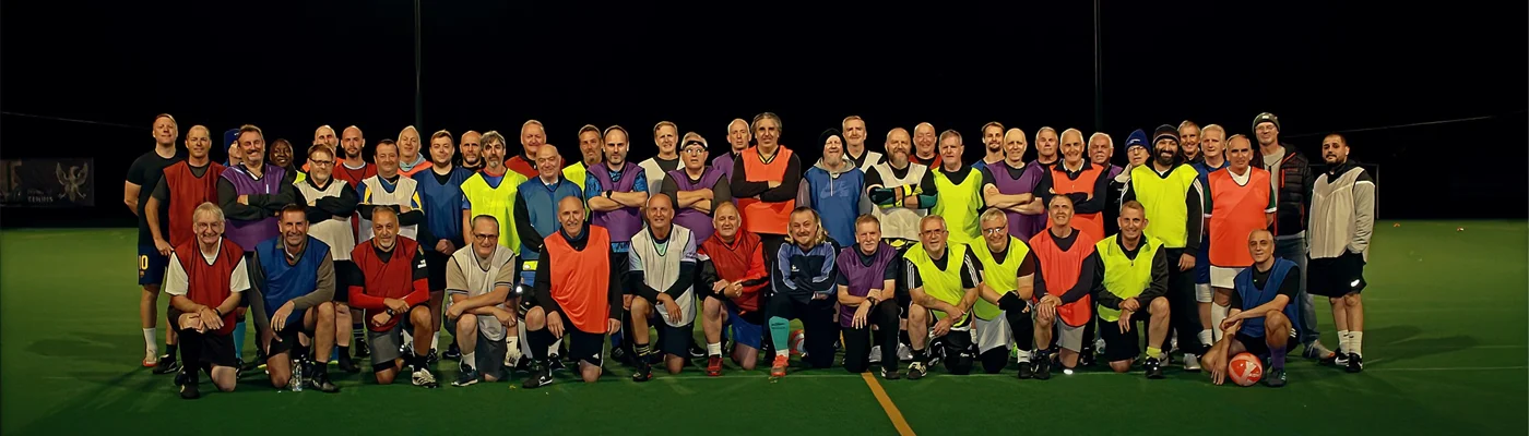 Bedford Walking Football players gathered on the pitch